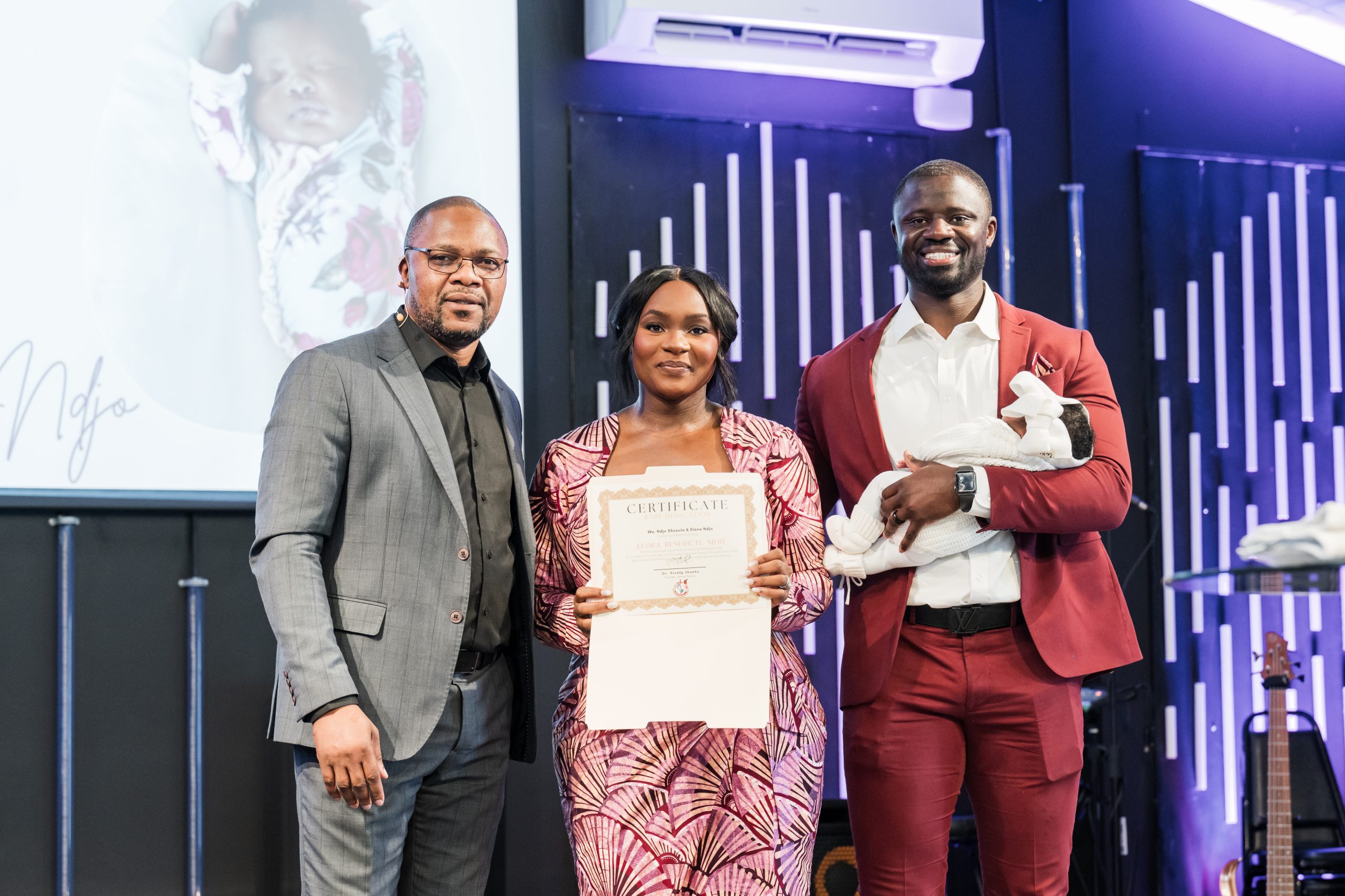 Baby Dedication Parents with Pastor
